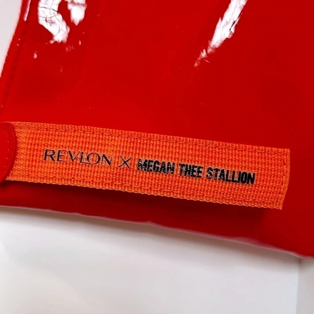 The Revlon x Megan Thee Stallion makeup bag with oversized zipper